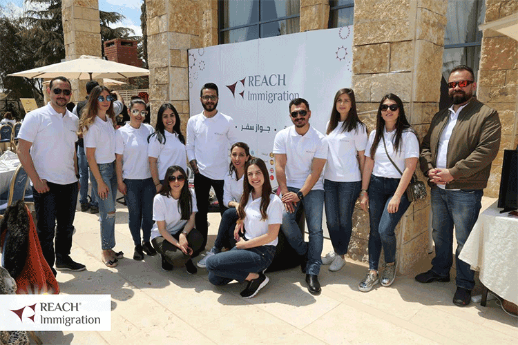Reach Immigration Amman team smiling and posing for a photo in dunes club