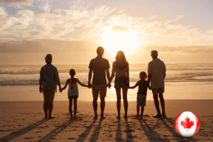 A family holding hands on the beach at sunset, enjoying the moment together