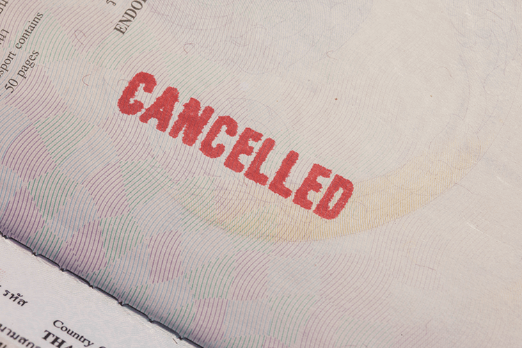Cancelled passport with red stamp indicating cancellation