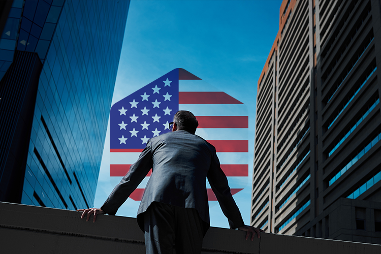 A suited man on a ledge gazes at a house resembling the American flag